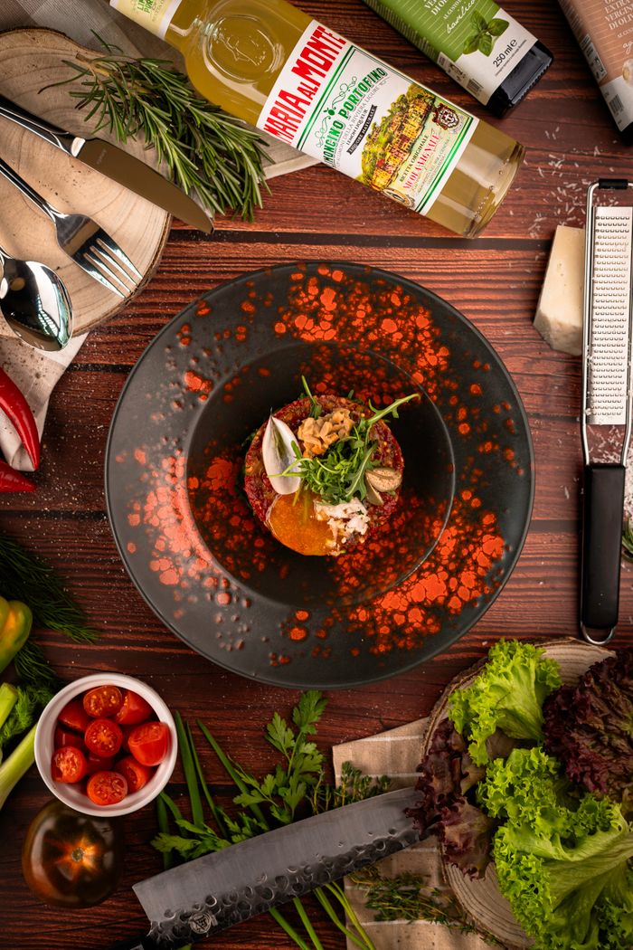 Creative overhead shot of a gourmet salad beautifully presented with fresh ingredients, perfect for food photography enthusiasts.